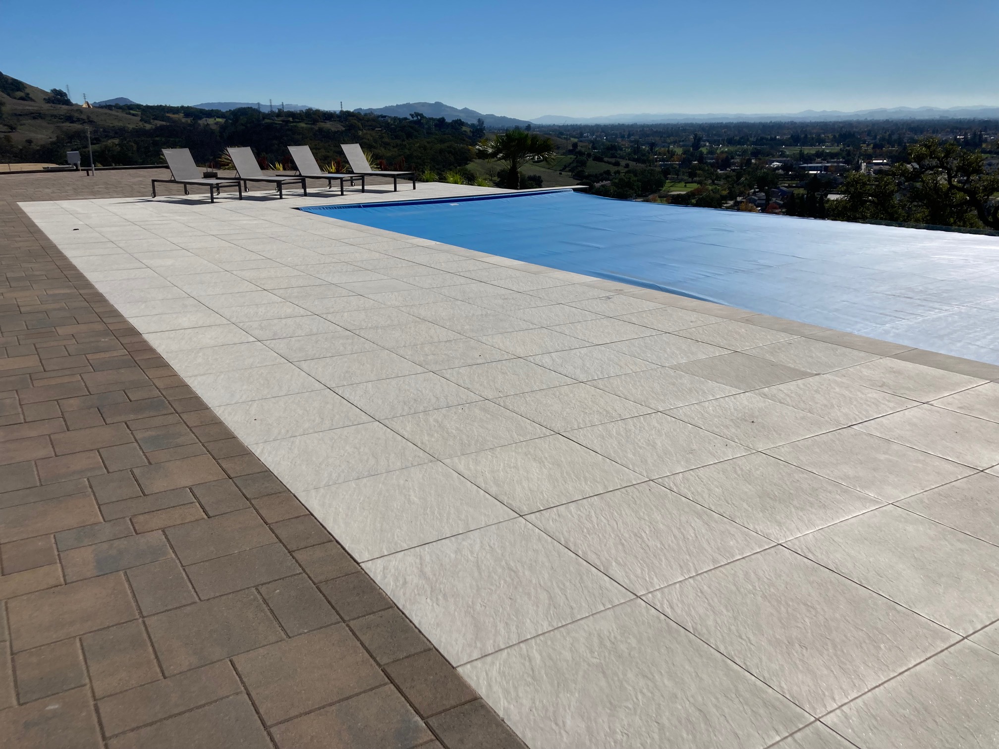 Stone paver pool deck by Legacy Pavers in Santa Rosa, CA.