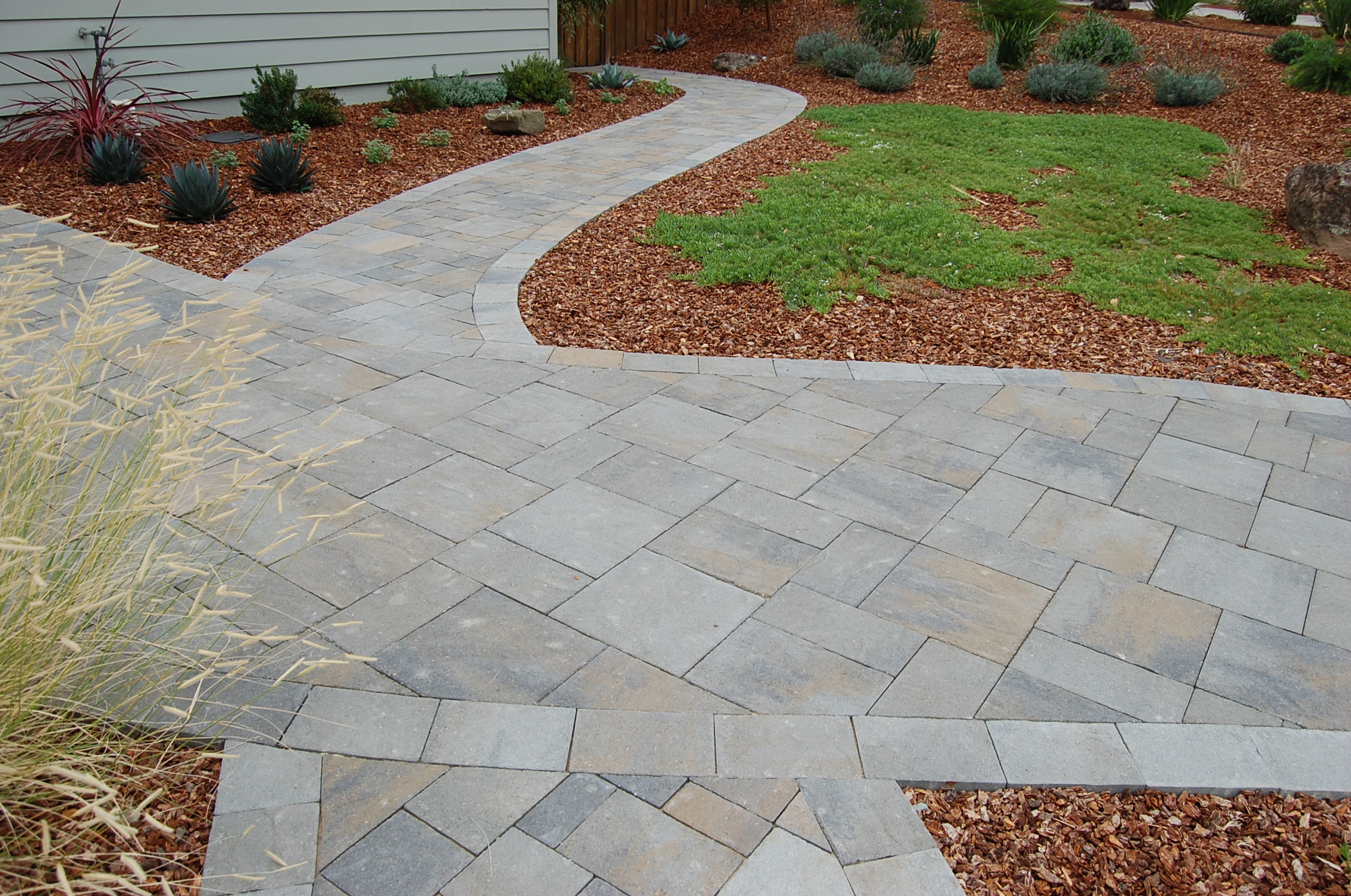 Legacy Pavers installs stone paver pathways and walkways.