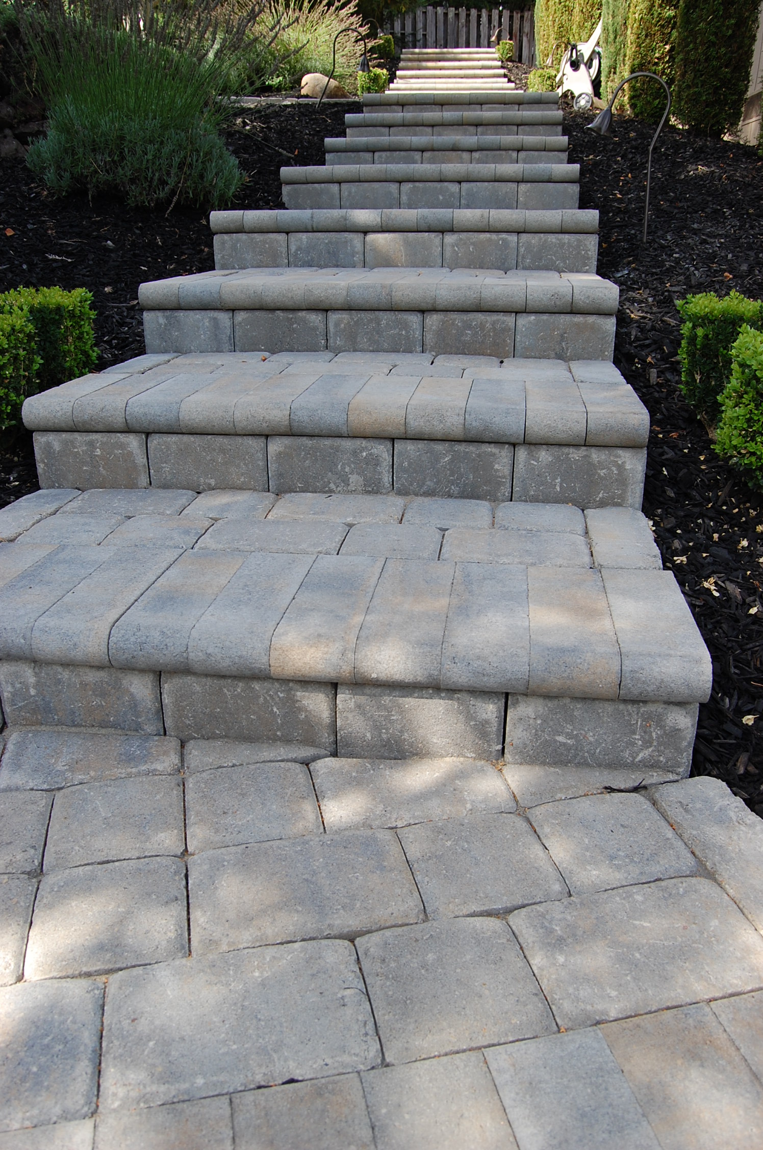 The Legacy Paver Group installs stone paver steps.