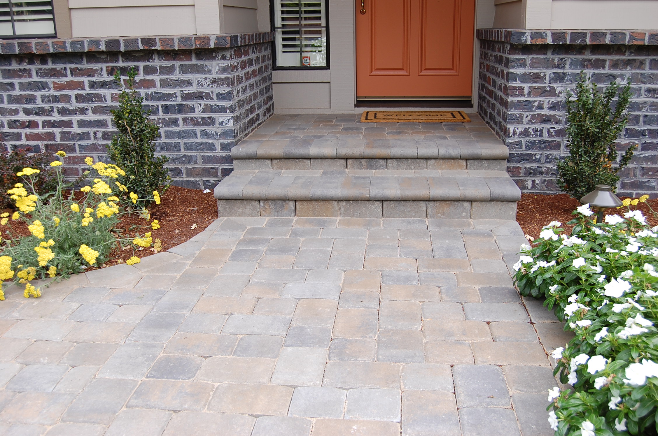 Stone paver steps by the Legacy Paver Group.