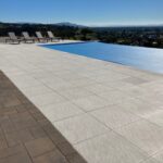 Another pool deck with stone pavers by the Legacy Paver Group.