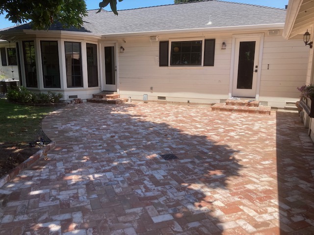 Stone paver patio by the Legacy Paver Group.