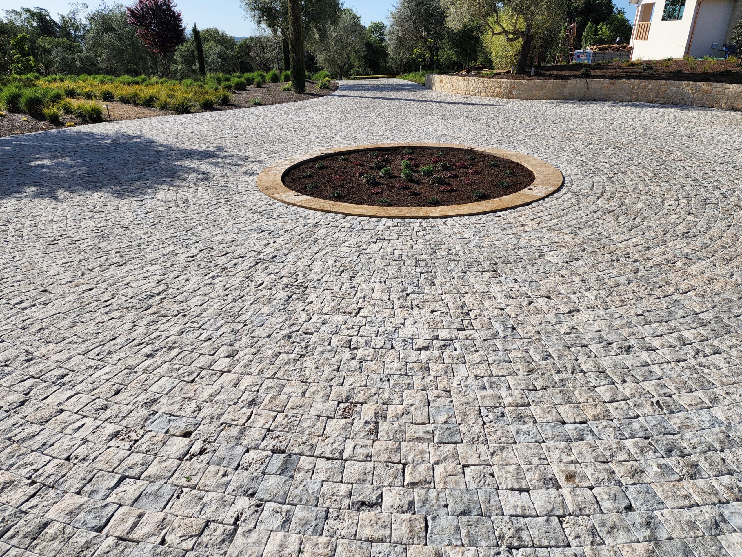 A beautiful stone paver driveway by the Legacy Paver Group.