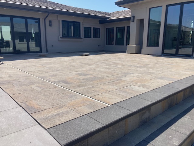 Stone paver patio by the Legacy Paver Group.